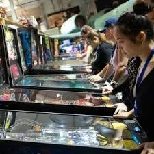 Teens playing arcade games
