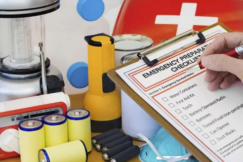 Emergency Kit with first aid kit, flashlights, lantern, and batteries