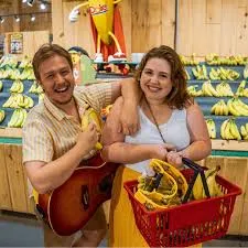 BenAnna Band holding a red tote with bananas.