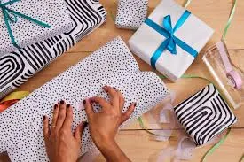 Hands wrapping presents